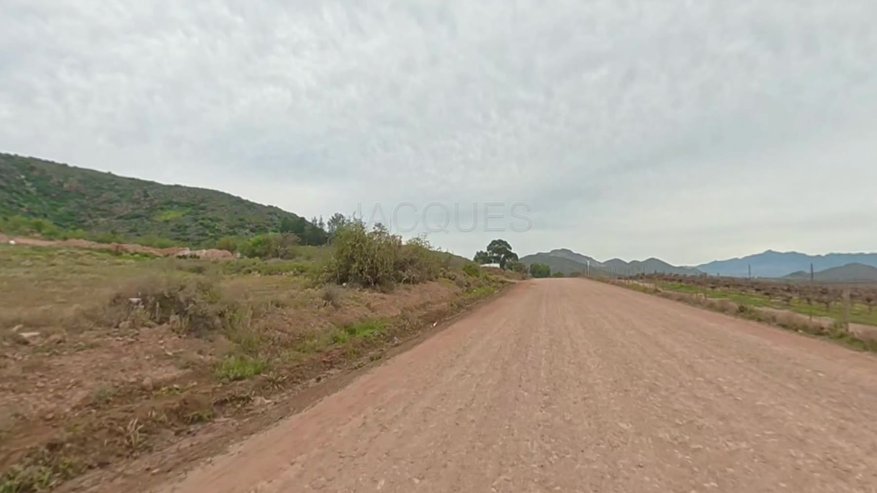 A gravel road running through an African landscape