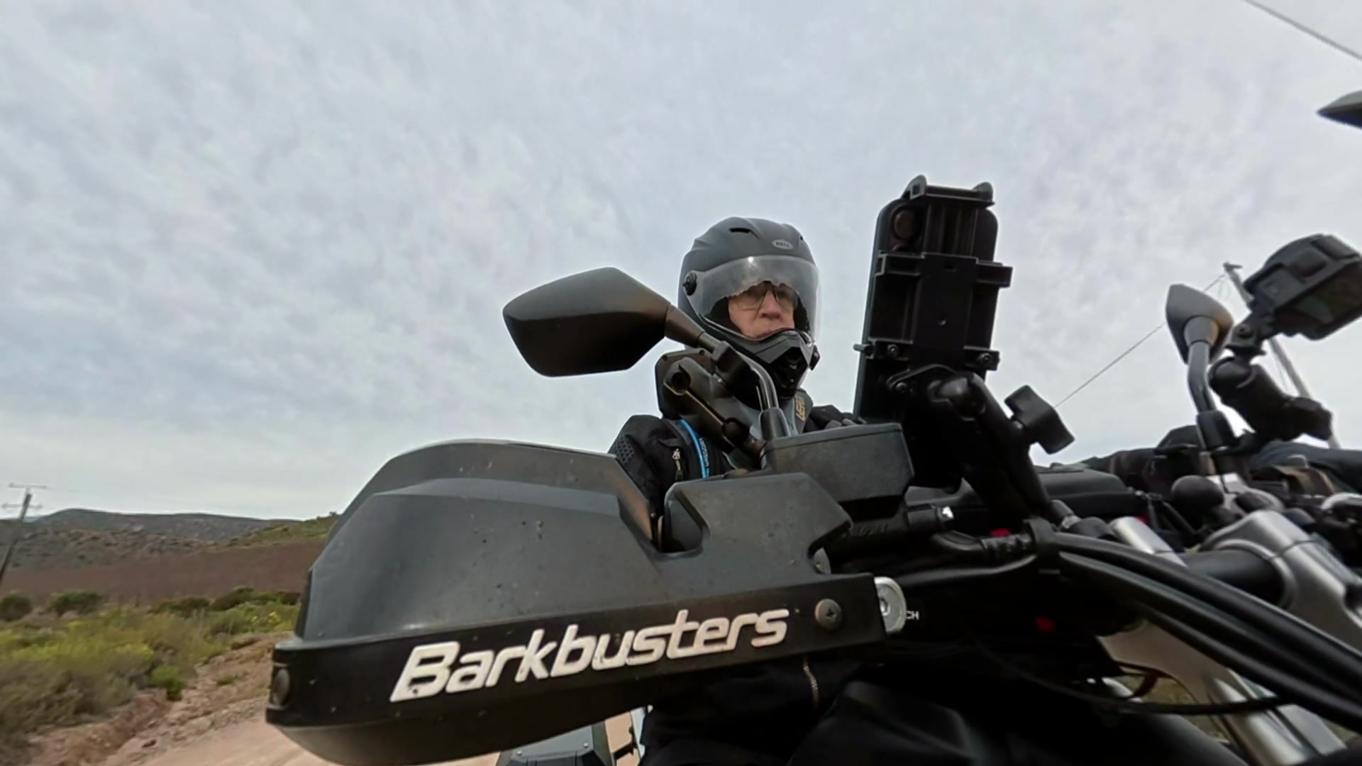 Jacques riding a motorcycle on a rural road
